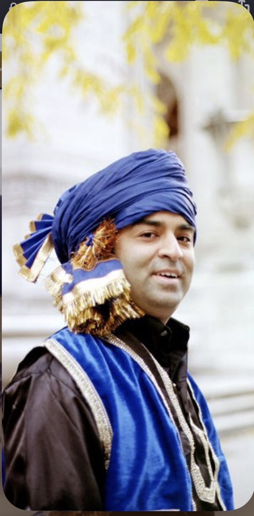 Rajeev Pahuja in a royal blue turban and velvet vest