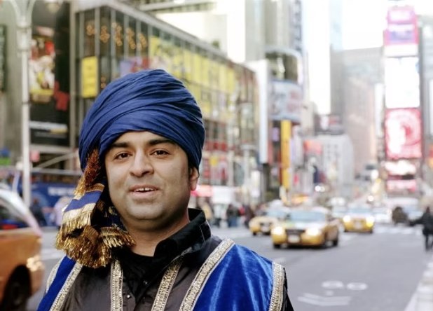 Rajeev Pahuja in a blue turban on a city street